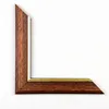 A corner piece of a picture frame, showing the wood grain and a gold inlay. Produktbild-Vorschau