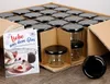 A box of glass jars with black lids and a recipe booklet. Podgląd zdjęcia produktu