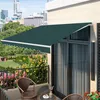A balcony with chairs, a table, and plants, shaded by a green awning. Náhľad obrázku produktu