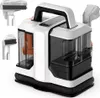 A white and black carpet cleaner with orange accents and several attachments. Náhled obrázku produktu