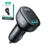 A black car charger with a carbon fiber texture and a digital display, shown next to its packaging. Produktbild-Vorschau