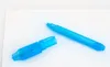 A blue pen with its cap off, lying on a white surface. Produktbild-Vorschau