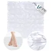 A transparent bath mat with a pebble-like texture, shown with a close-up of feet on the mat and a close-up of the suction cups. Náhľad obrázku produktu