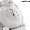 A close-up of a plush hedgehog toy with a projection panel on its belly. Voir les images du produit