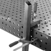A close-up view of a welding table with a metal tube clamped to it. Náhľad obrázku produktu
