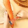 Hands peeling a carrot with a peeler. Voir les images du produit