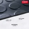 Close-up of a black rubber mat with raised circular patterns, showing its texture and thickness. Podgląd zdjęcia produktu