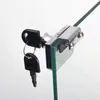 A close-up of a glass cabinet lock with two keys. Produktbild-Vorschau
