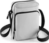 A light grey across body bag with black trim and strap, shown against a white background.