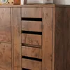 A close-up view of the drawers of a wooden dresser. Náhľad obrázku produktu