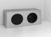 A silver electrical outlet with one socket and one blank cover, placed in a corner on a white surface. Produktbild-Vorschau