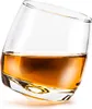 A single glass of amber liquid, likely whiskey, tilted on its side. Podgląd zdjęcia produktu