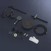 A collection of black shower system components laid out on a dark gray surface. Anteprima dell’immagine prodotto