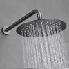 A shower head with water flowing out, mounted on a tiled wall. Náhled obrázku produktu