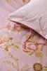 A close-up view of a pink floral patterned duvet cover and pillowcase. Produktbild-Vorschau