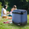 A family is having a picnic in a park, with a blue cooler in the foreground. Náhled obrázku produktu