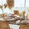 A beautifully set dining table with plates, bowls, cutlery, and decorative elements, suggesting a meal or gathering. Produktbild-Vorschau