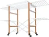A multi-tiered clothes drying rack with wooden frame and white metal bars, on wheels. Podgląd zdjęcia produktu