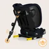 Rear view of a navy blue child car seat with yellow ISOFIX connectors and a strap with an orange circular graphic indicating a feature. Produktbild-Vorschau