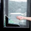 A hand is shown peeling back a piece of mosquito netting from a window frame. Produktbild-Vorschau