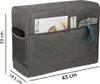 A grey fabric cover for a sewing machine with pockets holding various items like magazines, a ruler, and a cord. Produktbild-Vorschau
