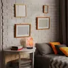 A bedside table with a salt lamp and books next to a bed with pillows. Náhled obrázku produktu