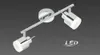 A chrome LED ceiling spotlight with two adjustable heads against a dark gray background. Produktbild-Vorschau