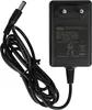 A black power adapter with a coiled black cable and a connector. Produktbild-Vorschau