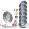A product box for LED downlights with a stack of the downlights on the right. Voir les images du produit