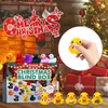 A Christmas-themed advent calendar box filled with rubber ducks, set against a festive backdrop with a Christmas tree and fireplace. Produktbild-Vorschau