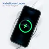A smartphone with a green case is placed on a wireless charger, showing a charging animation on its screen. Produktbild-Vorschau