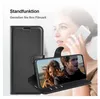 A woman is on the phone while a phone case is displayed in the foreground, showing its stand function with a video playing on the phone. Produktbild-Vorschau