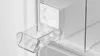 A close-up view of an ice dispenser drawer filled with ice cubes inside a refrigerator. Anteprima dell’immagine prodotto