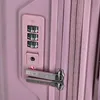 Close-up of a pink suitcase lock and zipper. Produktbild-Vorschau