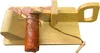 A wooden sausage slicer with a piece of sausage attached and several slices of sausage on the cutting board. Náhled obrázku produktu