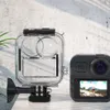 A waterproof case and an action camera are displayed on a surface with a textured wall in the background. Produktbild-Vorschau