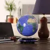 A floating globe is displayed on a wooden desk next to a laptop, a cup, and a lamp. Náhľad obrázku produktu