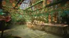 A lush, vibrant greenhouse filled with various plants and flowers, featuring stained glass windows and wooden planters. Anteprima dell’immagine prodotto