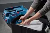 A person is shown placing a dust bag into a black container next to a blue Bosch wet/dry vacuum cleaner. Anteprima dell’immagine prodotto