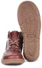 A pair of red leather boots, one standing upright and the other showing its sole. Anteprima dell’immagine prodotto
