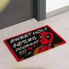 A doormat with Deadpool on it, placed in front of a door. Produktbild-Vorschau