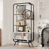 A tall, black metal bookshelf with white shelves and a white cabinet at the bottom, decorated with various items including books, vases, and decorative objects. It is placed in a room with a marble fireplace and white walls. Produktbild-Vorschau