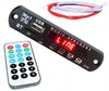 A close-up shot of a car audio adapter board and its remote control, displayed on a white background. Podgląd zdjęcia produktu