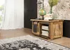 A wooden cabinet with sliding doors, a globe, books, and a vase of flowers on top, placed on a rug in a room. Produktbild-Vorschau