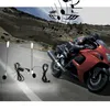 A motorcyclist riding a red motorcycle on a winding road, with musical notes floating in the air above. Náhled obrázku produktu