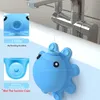 A blue octopus-shaped bathtub overflow drain cover is shown attached to a bathtub faucet. Produktbild-Vorschau