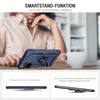 A person is holding a blue phone case with a ring stand on a table. Produktbild-Vorschau