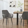 A dining set with two chairs and a table in a room. Voir les images du produit