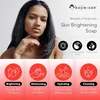 A woman is shown with marketing graphics and text promoting Kojie San Skin Brightening Soap. Anteprima dell’immagine prodotto