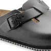 A close-up view of a black Birkenstock sandal with a buckle. Produktbild-Vorschau